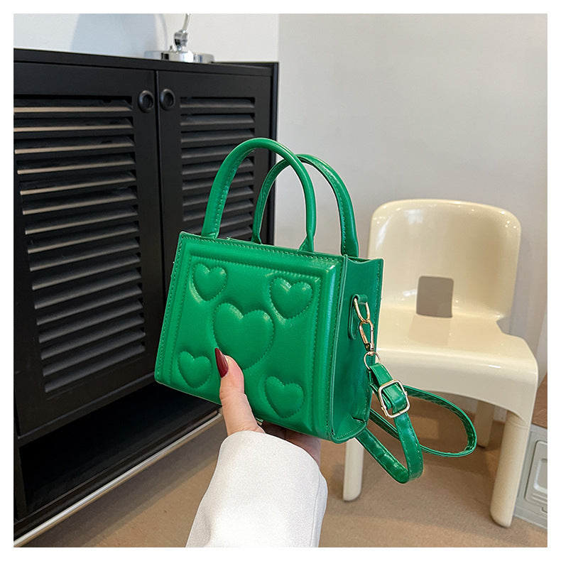 1pc Women’s Stylish Solid Color Handbag with Detachable Strap – Heart Pattern Design, Perfect for Valentine’s Day Gift, Available in Magenta, White, Black, Green, Yellow
